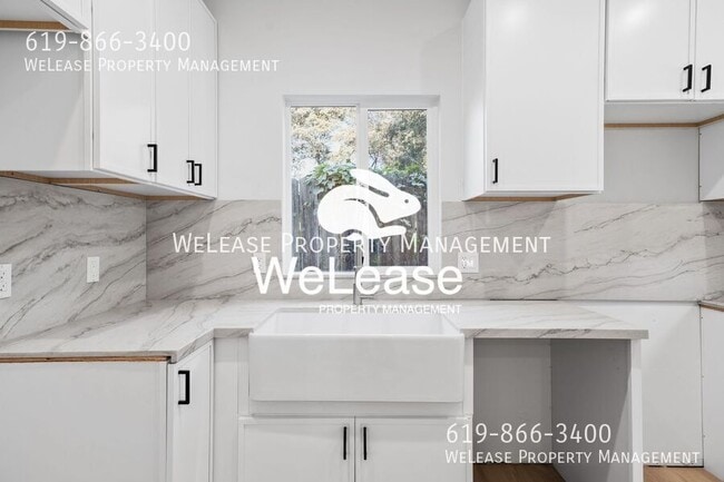 Building Photo - 5966 Carnegie St Unit 1