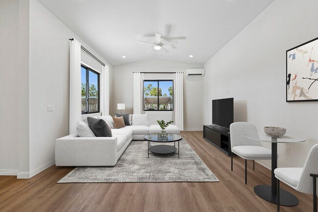 Freestanding Home dining and living room with hard-surface flooring - eaves San Marcos