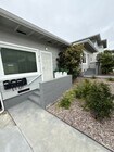 Landscaped front entrance and mailboxes. - 310 -316 Rosecrans St Apartments