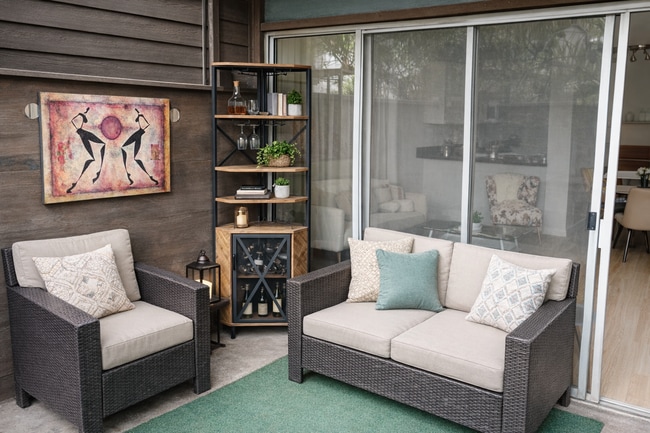 Private patio with seating for relaxing outdoors. - 4401 Kraft Ave