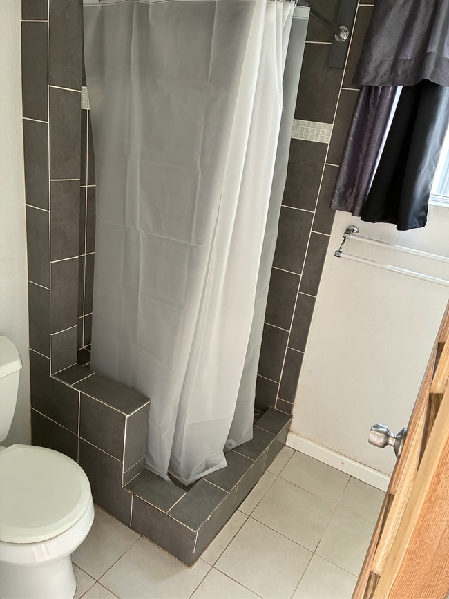 Bathroom/shower w/plenty of storage cabinets. - 3580 Colonial Ave Unit Guesthouse /Studio for rent