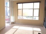 Living Room & Door to Balcony - 530 K St Unit San Diego Gaslamp Quarter