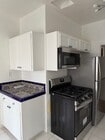new stainless microwave and stove - 232 N Clark Dr