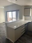 Kitchen and Balcony - 2462 Purdue Ave Apartments Unit 102