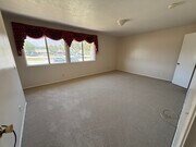 Spacious primary suite with double closets, private bath, and mountain view. - 1134 W Huntington Dr Townhome