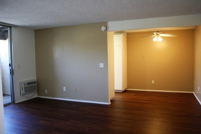 Two Bedroom 1 bath Living room and dining room - 105 Monterey Pines Apartments