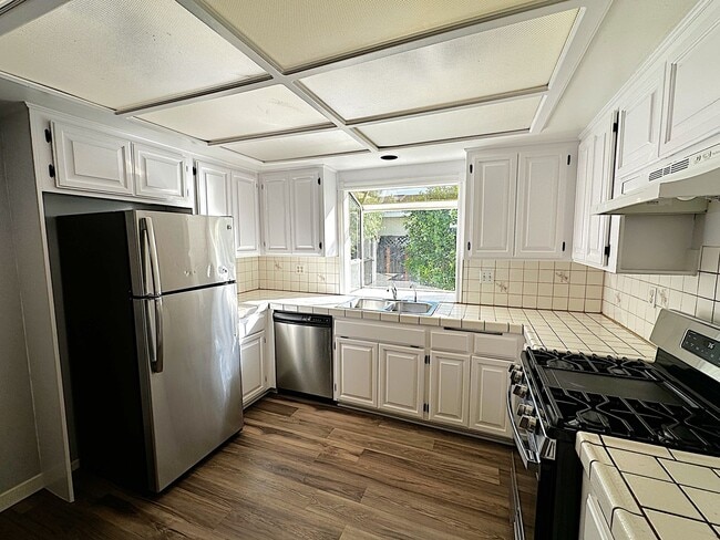 Photo - Spacious 4-Bed, 2-Bath Home with Garage an...