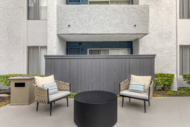 Relaxation awaits: Unwind poolside at Cornerstone Apartments with your own private patio oasis. Dive into serenity and soak up the sun in style. - Cornerstone Apartment Homes