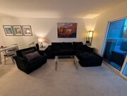 Living Room. Dining area to left and balcony to right. - 3542 Shoreline Bluff Lane
