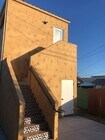 Rear entrance and door to first-floor storage. - 4470 Swift Ave Apartment Unit ADU