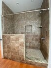 Large tiled walk-in shower with bench. - 10563 Cushdon Ave Unit ADU