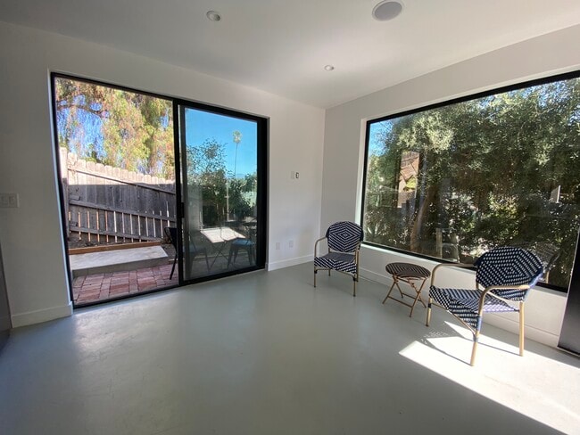 Sliding doors look out onto a clay brick patio. Coffee or wine anyone? - 4435 Radium Dr