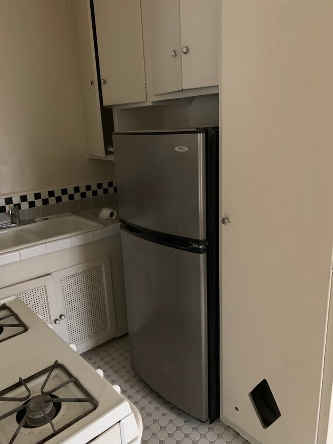 Kitchen with Stove and Refrigerator With Custom Tile Floors - 824 1/2 S Curson Ave Unit 824 1-2