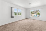 Photo - Spacious 4-Bed Home with Backyard, Garage & Prime Westside Access