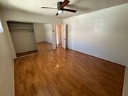 Bedroom (two closets, ceiling fan, and window AC unit) - 147 Genoa St Apartments Unit D