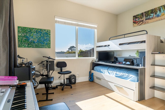 5th bedroom - downstairs with sliding door access to backyard - 3687 Valley St