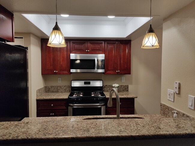 Open kitchen with Breakfast counter - 9428 Twin Trails Dr Unit 302