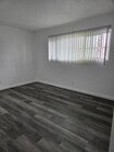 2nd bedroom with luxury vinyl plank flooring - 3455 Elm Ave Unit #215