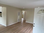 Living room with dimmable recessed lighting and wall heater - 2912 Peppertree Ln Apartments Unit A
