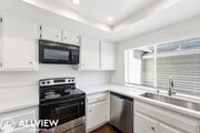 Photo - Fully Renovated 2 Bed Townhome with Private Patio, 2-Car Garage & Community Pool