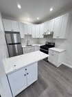 Kitchen with barstool - 13180 Branford St House