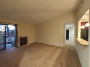 Living room, high ceiling and fireplace - 9428 Twin Trails Dr Unit 302