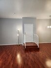 Stairs separating living and dining space - 7037 La Tijera Blvd Condo Unit A101