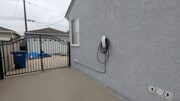 Driveway with Tesla charger - 5732 Yearling St House