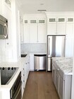 Kitchen w/ Marble & Caesarstone countertops - 10501 Wilshire Blvd Unit PH10