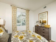Master bedroom with a window on the left and can fit a queen bed with 2 nightstands and a dresser - Stone Creek Apartments