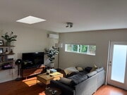Bright living room with new mini-split A/C & heat - 4360 Stewart Ave