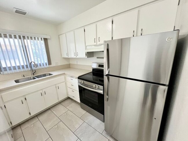 Photo - Spacious 2BR/1.5BA Townhome with A/C, Parking & Luxury Community Amenities