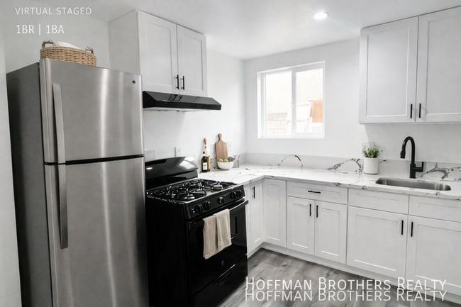 Building Photo - 5495 Atlantic Ave Unit 18