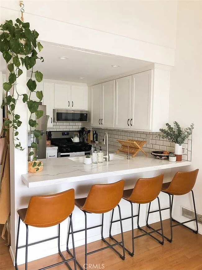 Photo - Coastal-Chic 1BR with In-Unit Laundry, Central A/C, and All Utilities Included — Steps to Hunting... Unit 202