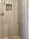tiled primary en-suite shower walls. - 1214 Rutland Rd Apartment Unit 1