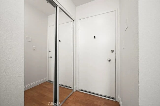 Building Photo - "Chic 1-Bed Retreat with Pool & Central Vacuum in Anaheim's Heart – 710 Sq Ft of Hardwood Elegance!"