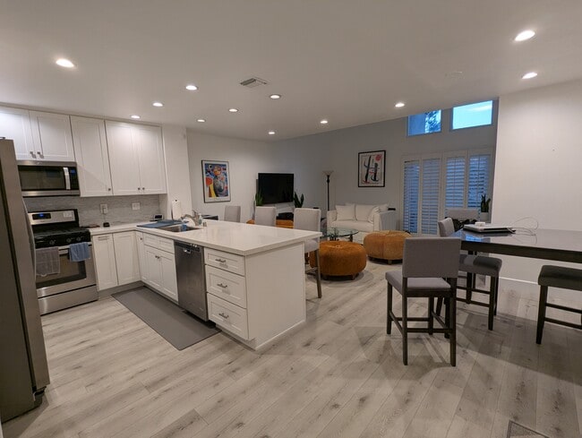 kitchen, dining, living areas - 20 Corsica Dr Townhome