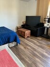 The TV will be removed from the couch. - 1133 La Tortuga Dr Apartments Unit Studio