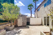 Let your furry friends get some outdoor fun in this gated backyard - 2304 E 14th St House