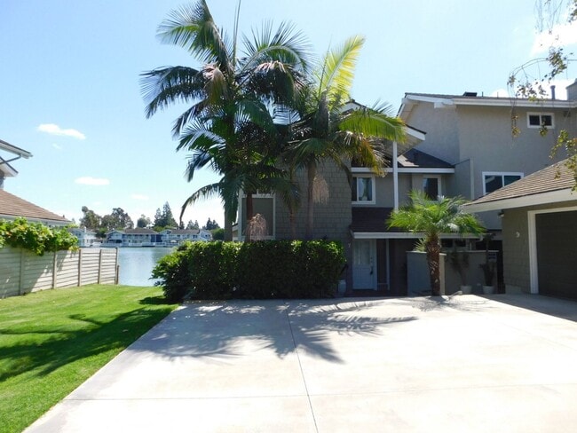 Building Photo - BREATHTAKING LAKE VIEW! Gated Lake community 3 bedroom plus 1 Den 2.5 bath Home