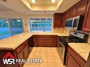 Photo - Spacious 5 Bedroom Home Near Victoria Ave with Easy Freeway Access