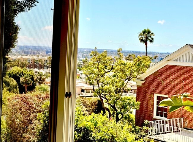 Living room window with some ocean view - 1760 N Fairfax Ave