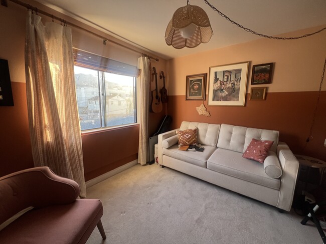 Office-Bedroom Conversion - Pop-up desk under window with mountain view. Comfy fold-out Queen bed. - 620 E Harvard Rd Unit G