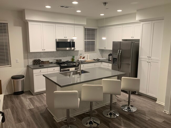 Common kitchen area with access to stove, refrigerator, dishwasher, and other culinary appliances. Dining area not pictured. - 1434 Santa Victoria Road