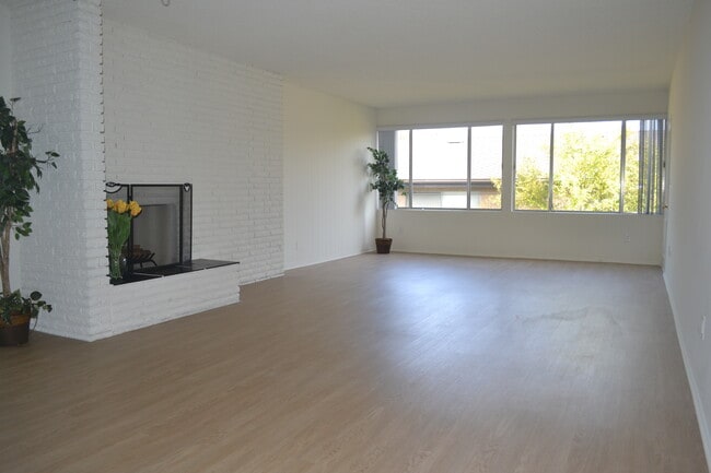 Spacious Living Room with Fireplace - The Continental Arcadia Apartments