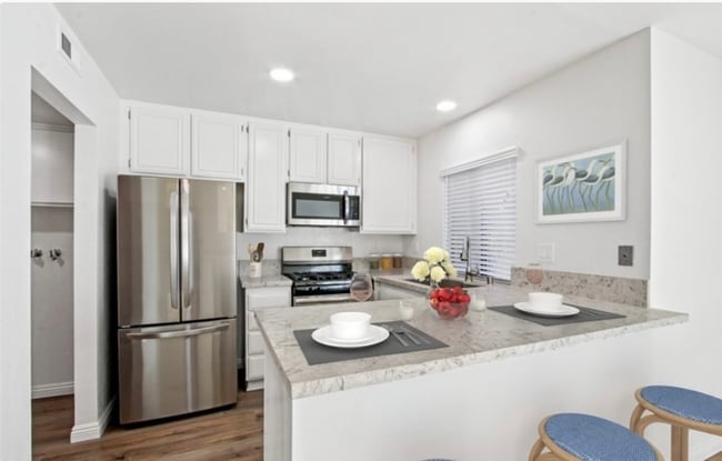 Building Photo - Stylish Coastal Condo in Newport Terrace –...