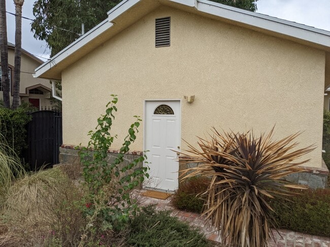 Front door open to Garden - 17915 Erwin St Unit Apartment
