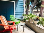 Two colorful patio chairs to relax w/ coffee - 6000 Bixby Village Dr Unit #13