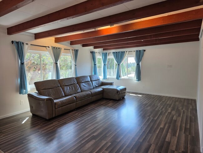 View of the living room. Plenty of natural light with trees for privacy. Couch optional. - 456 E Indian Rock Rd