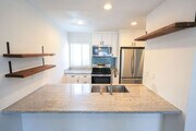 Granite countertops and stainless steel appliances - 4152 Mount Alifan Pl Condo Unit E